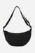 Black corduroy shoulder bag with adjustable strap and zip closure, lightweight and roomy design.