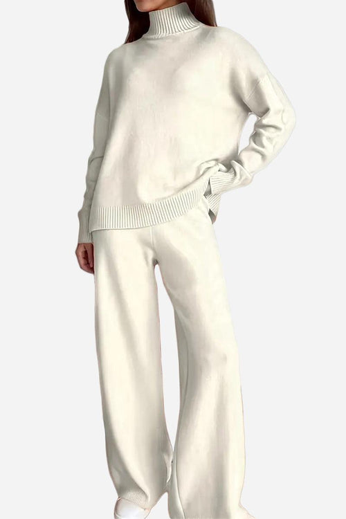 Woman wearing an off-white knitted turtleneck sweater and wide-leg pants two-piece set