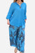 Blue vibrant fusion two-piece set with solid long-sleeve top and printed flowy pants for women