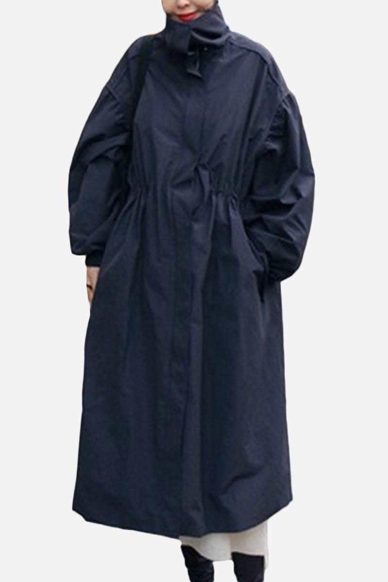 Oversized black cotton stain-resistant coat with high collar and relaxed fit for travel and all-season wear