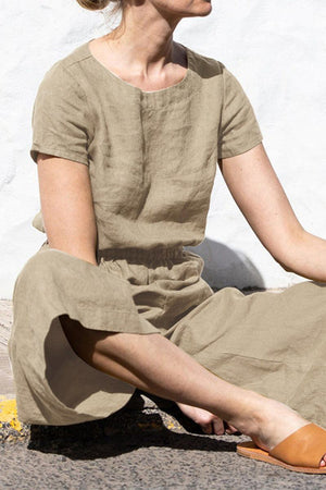 Woman wearing a beige pure cotton minimal confidence two-piece set sitting outdoors