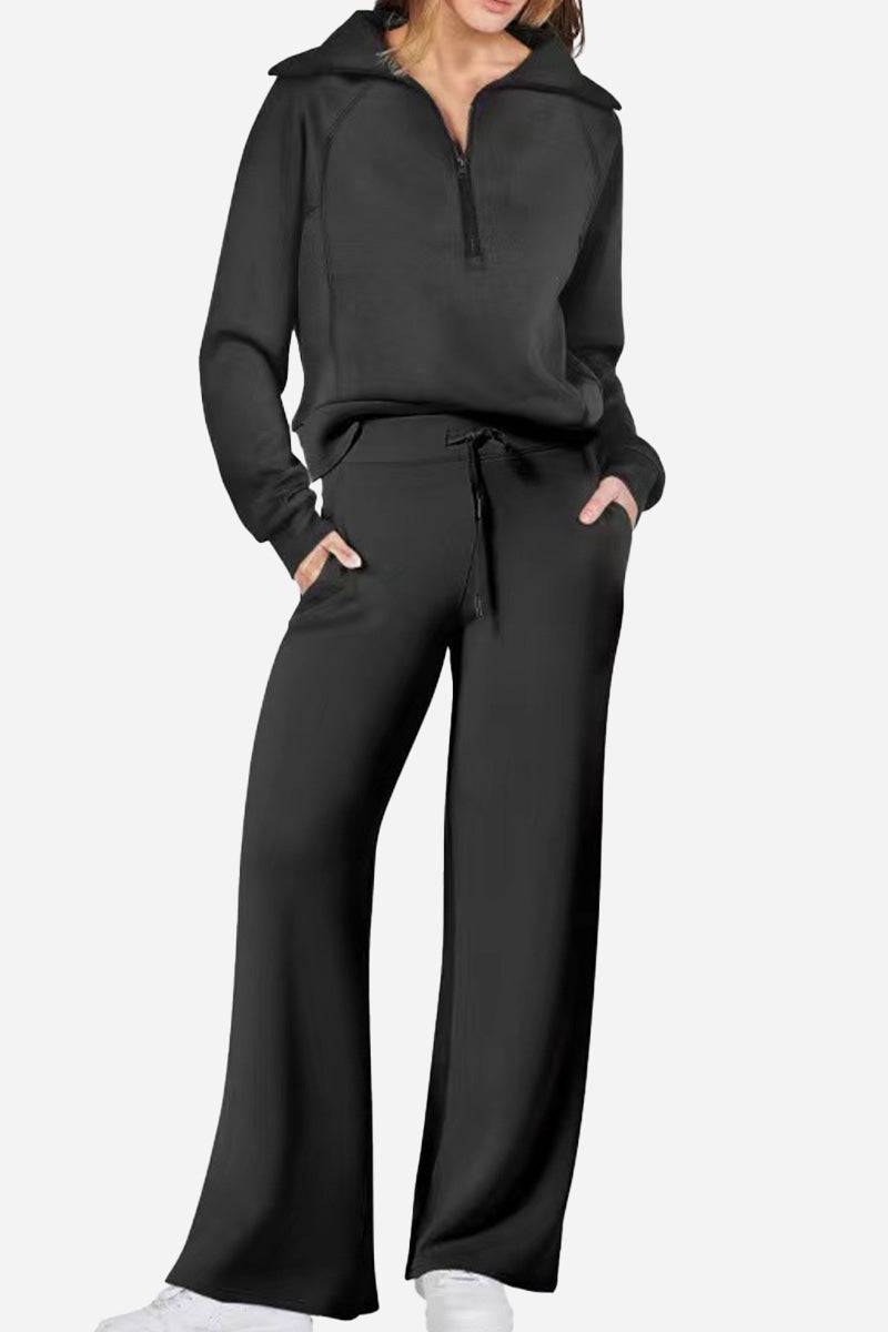 Black loungewear buttersoft tracksuit set with zip-up oversized top and wide-leg pants.