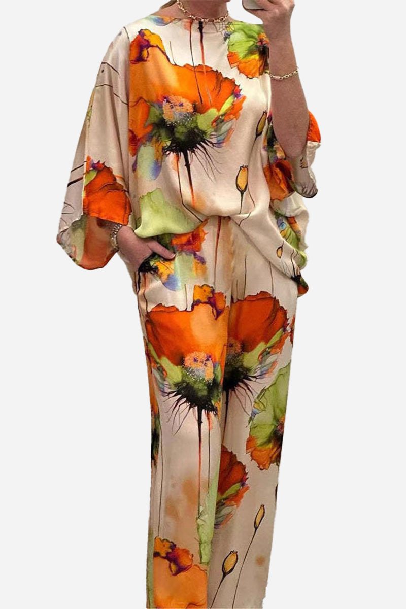 Plus size vibrant floral matching set with flowy silhouette in orange and green floral patterns