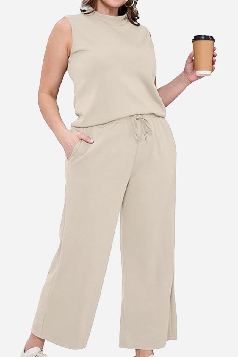 Beige cotton chic sleeveless two-piece set with relaxed fit, drawstring pants, and pockets, styled for casual comfort and travel.