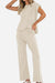 Beige first class travel two-piece set with pleated wide-leg pants and a loose short-sleeve top for wrinkle-resistant comfort and style