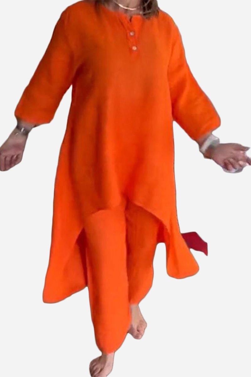 woman wearing breathable and featherlight vibrant orange two-piece lounge set with long top and pants
