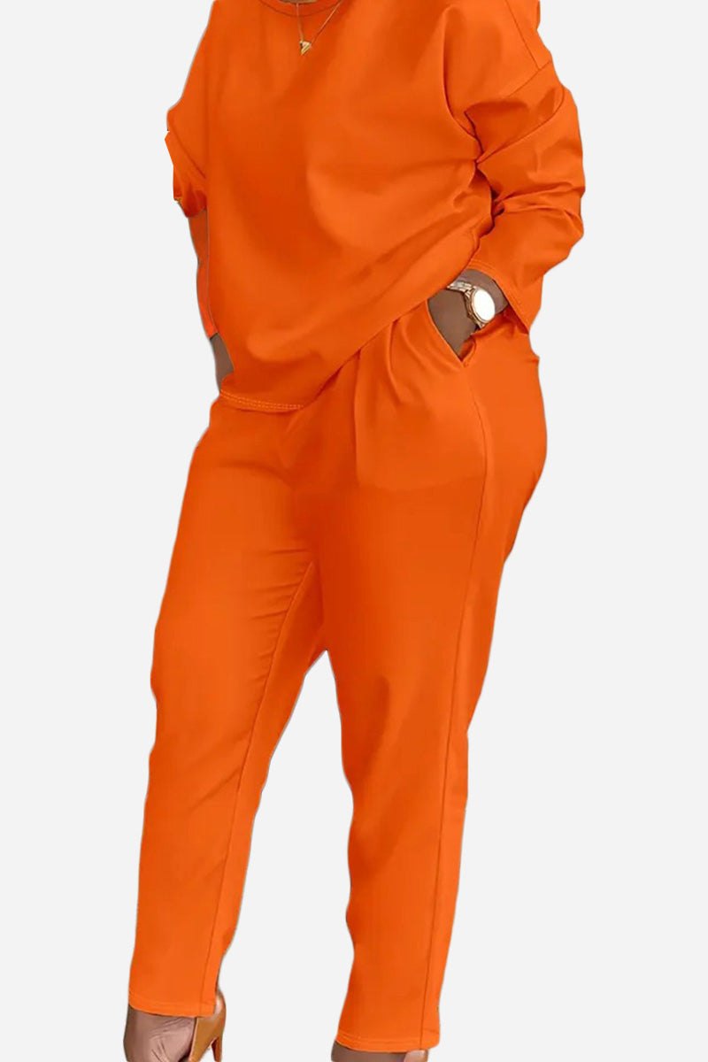 Vibrant orange cotton two-piece set with long sleeves and pants in a comfortable, stretchy fit