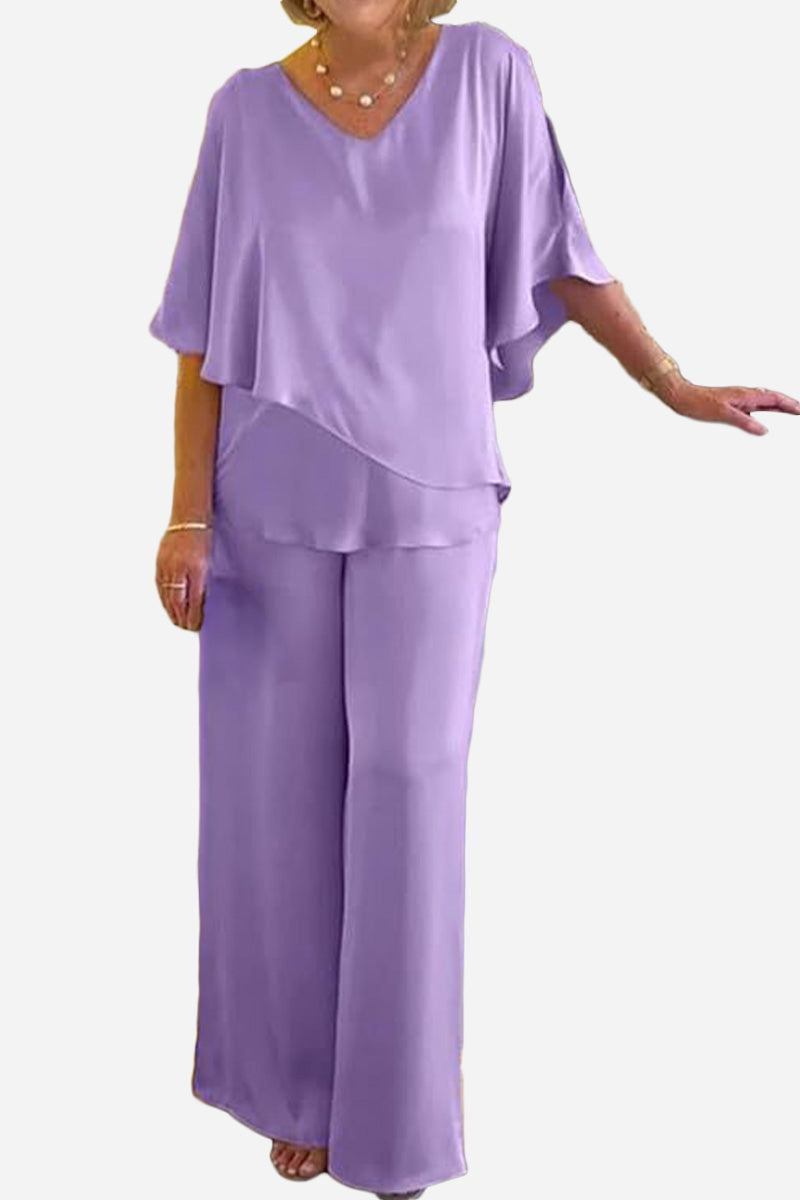 Woman wearing a lavender Elegant Layers Two-Piece Set with a layered V-neck top and wide-leg pants.
