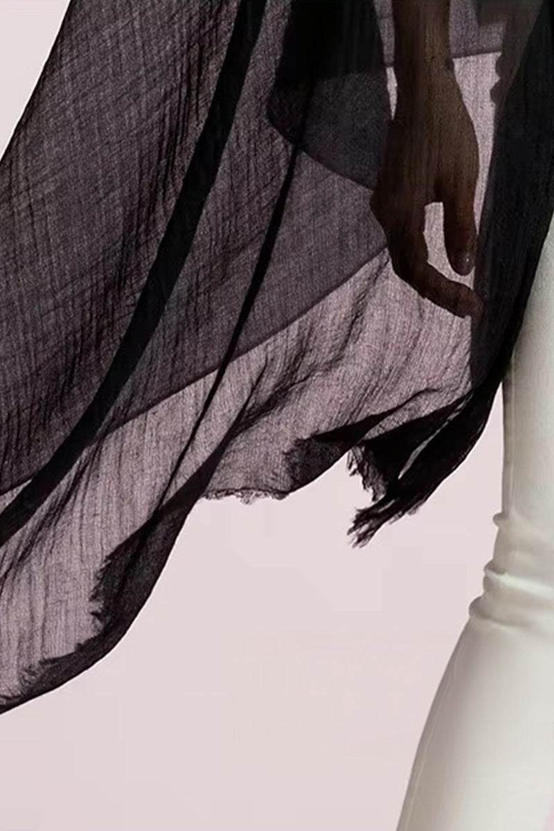 Lightweight black 100% cashmere featherlight luxury scarf draped over shoulder