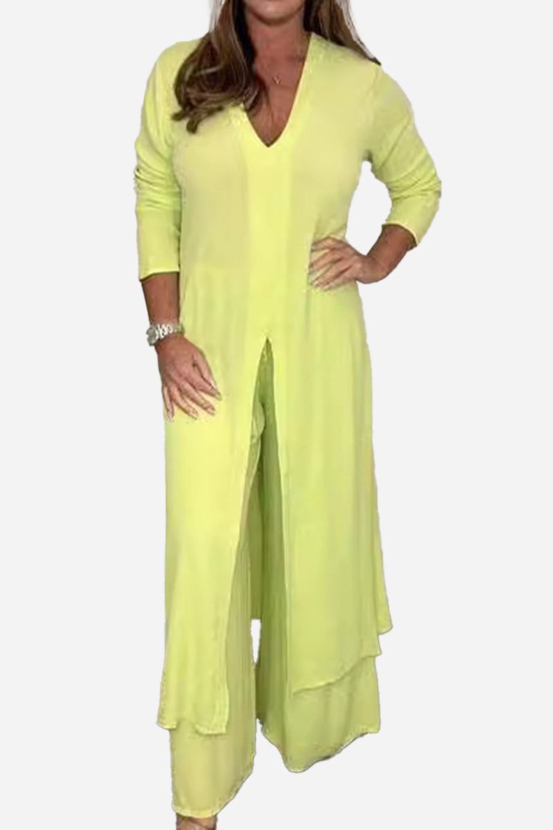Woman wearing a yellow Urban Chic V-Neck Split Top two-piece set with long sleeves and flowing pants.