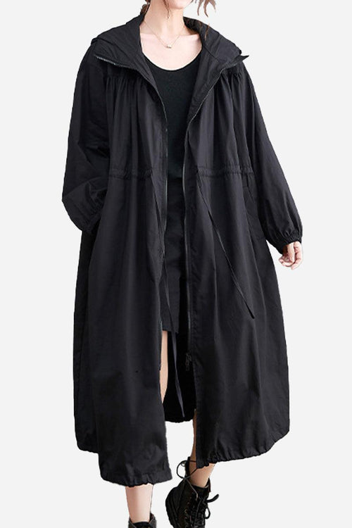 Black oversized all-weather water-resistant windbreaker with hood and long sleeves, loose fit for layering and comfort