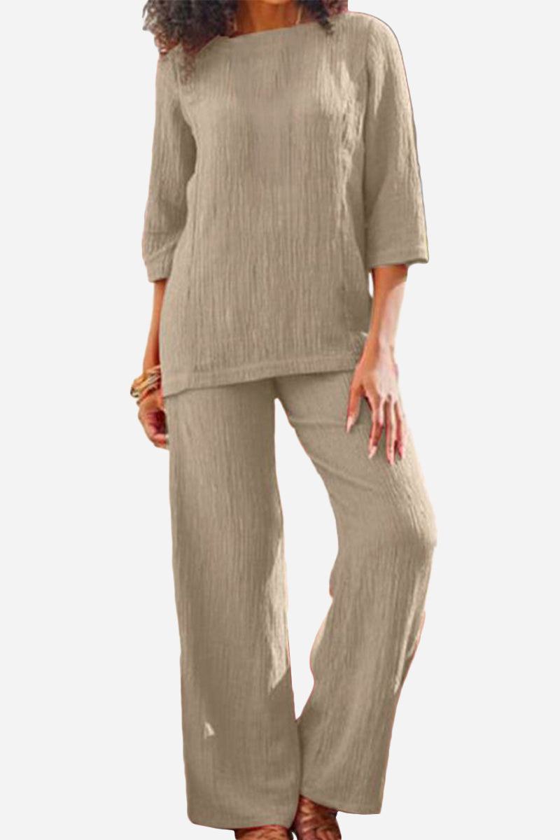 Beige textured two-piece set with loose fit top and wide-leg pants for comfortable, elegant wear