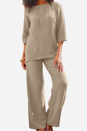 Beige textured two-piece set with loose fit top and wide-leg pants for comfortable, elegant wear