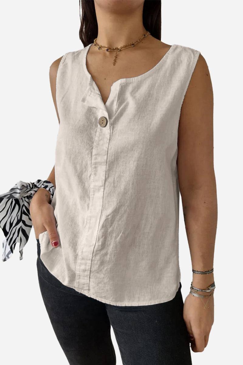Women’s 100% pure linen sleeveless vest with V-neck and button detail in natural beige color, styled with black pants and accessories.