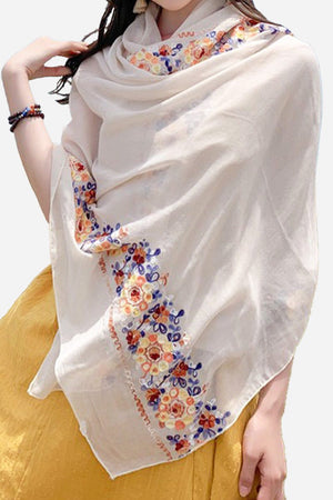 Lightweight embroidered travel-must shawl wrap with floral border, versatile and breathable accessory for travel and sun protection