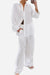 white 100% cotton two-piece wanderlust set with long-sleeve shirt and wide-leg pants for travel comfort and style