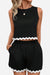 Black sleeveless two-piece set with white scalloped hem on top and shorts, flattering coastal scallop style.