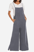Woman wearing a breathable gray cotton blend comfort jumpsuit with wide legs and pockets over a white t-shirt