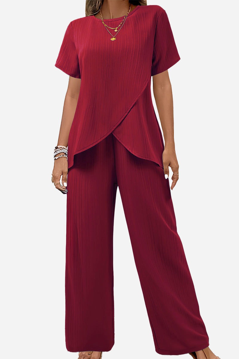 Women's textured elegance two-piece set in deep red with asymmetrical top and wide-leg pants