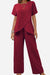 Women's textured elegance two-piece set in deep red with asymmetrical top and wide-leg pants