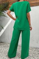 Women's green textured elegance two-piece set with asymmetrical top and wide-leg pants, soft stretch fabric for comfort and wrinkle resistance.