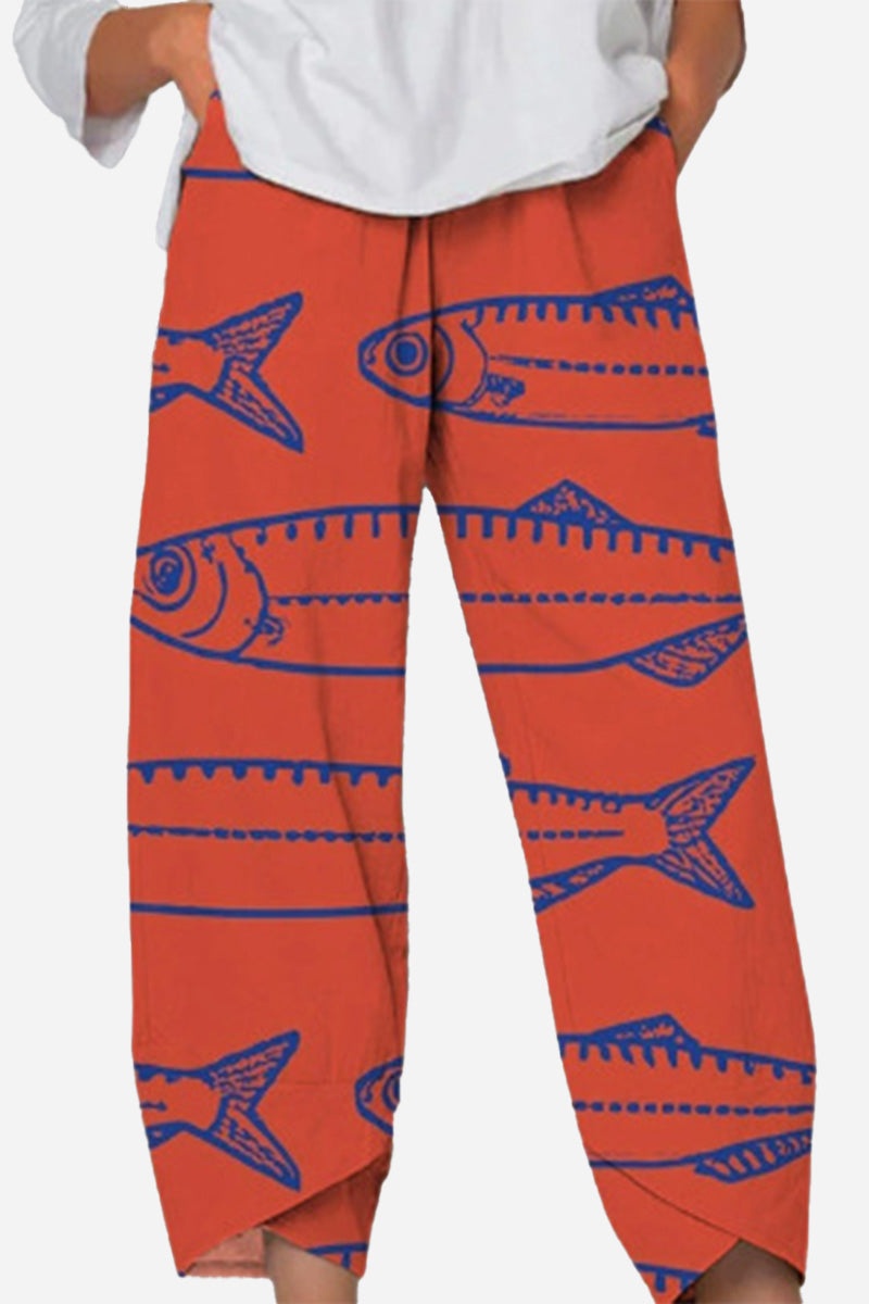 Breathable cropped pants with artistic sardine pattern in red and blue, featuring a relaxed fit and comfortable waistband.