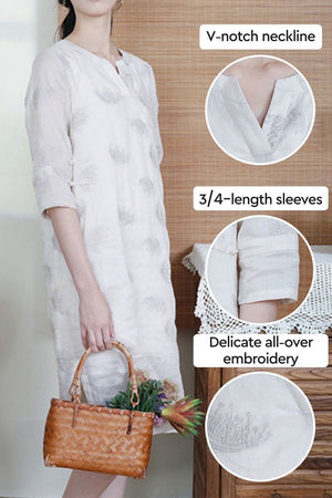 100% linen dress with V-notch neckline, 3/4-length sleeves, and delicate all-over embroidery in white