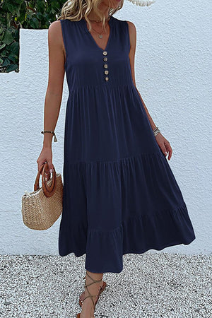 Bohemian tiered midi dress in navy with V-neck and button detail, sleeveless and flowy summer style