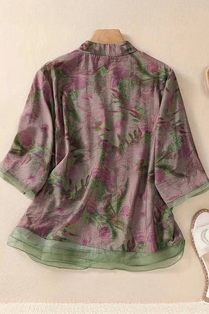 French boutique style organza blouse with floral print and green sheer trim