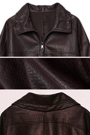 Close-up of dark brown genuine sheepskin leather jacket showing texture and collar details
