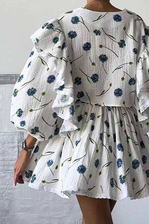 Woman wearing Sweet Countryside 100 Cotton white ruffled two-piece set with blue floral print from the back