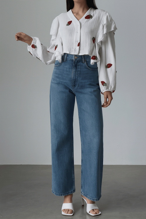 Sweet Countryside 100% cotton ruffled white blouse with strawberry prints paired with blue jeans.