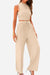 Beige ribbed knit sleeveless crop top and wide-leg pants two-piece set with drawstring waistband.