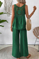 Woman wearing green Dreamcatcher Crochet-Back sleeveless top and wide-leg palazzo pants set