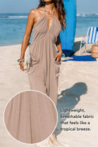Sunshine On Sand halter-neck jumpsuit with ruched neckline and wide-leg silhouette in lightweight breathable fabric perfect for beach and casual wear