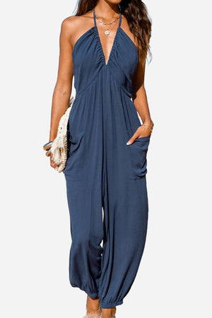 Sunshine On Sand navy halter-neck jumpsuit with ruched neckline and elastic ankle cuffs