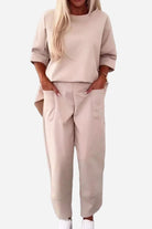 Beige relaxed fit two-piece set with crew neck sweatshirt and jogger pants with pockets