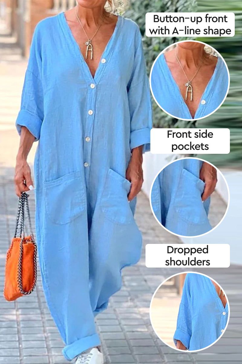 Blue relaxed jumpsuit with button-up front, front pockets, and dropped shoulders.