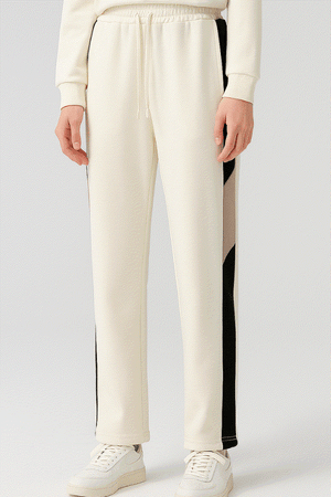 Comfort in Motion white athleisure tracksuit pants with black side stripes and elastic waist