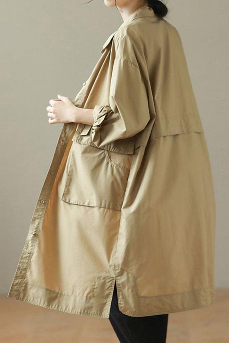 Beige Nomad Ease Oversized Shirt-Jacket with roll-up sleeves and large front pockets worn by woman.