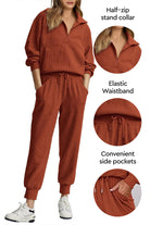 Unisex half-zip pullover and sweatpants set in rust color with stand collar, elastic waistband, and side pockets for casual comfort and style