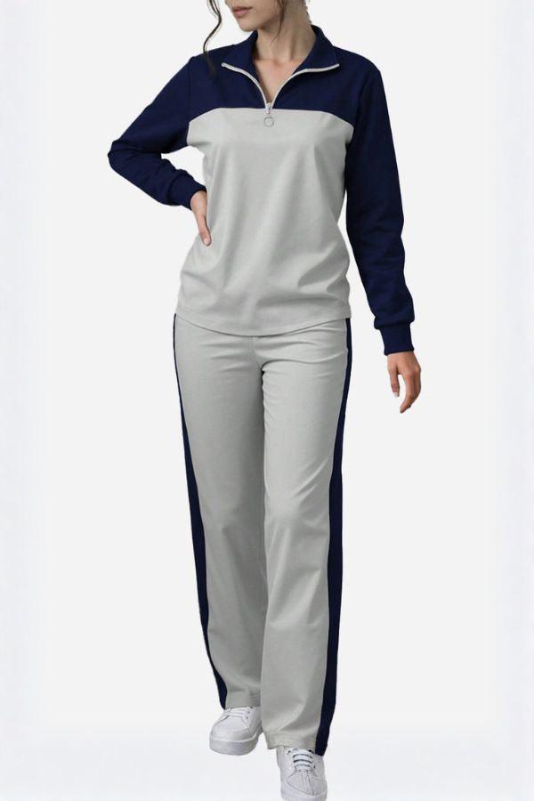 Woman wearing Colorblock Comfort Leisure Set with navy and gray half-zip top and wide-leg pants