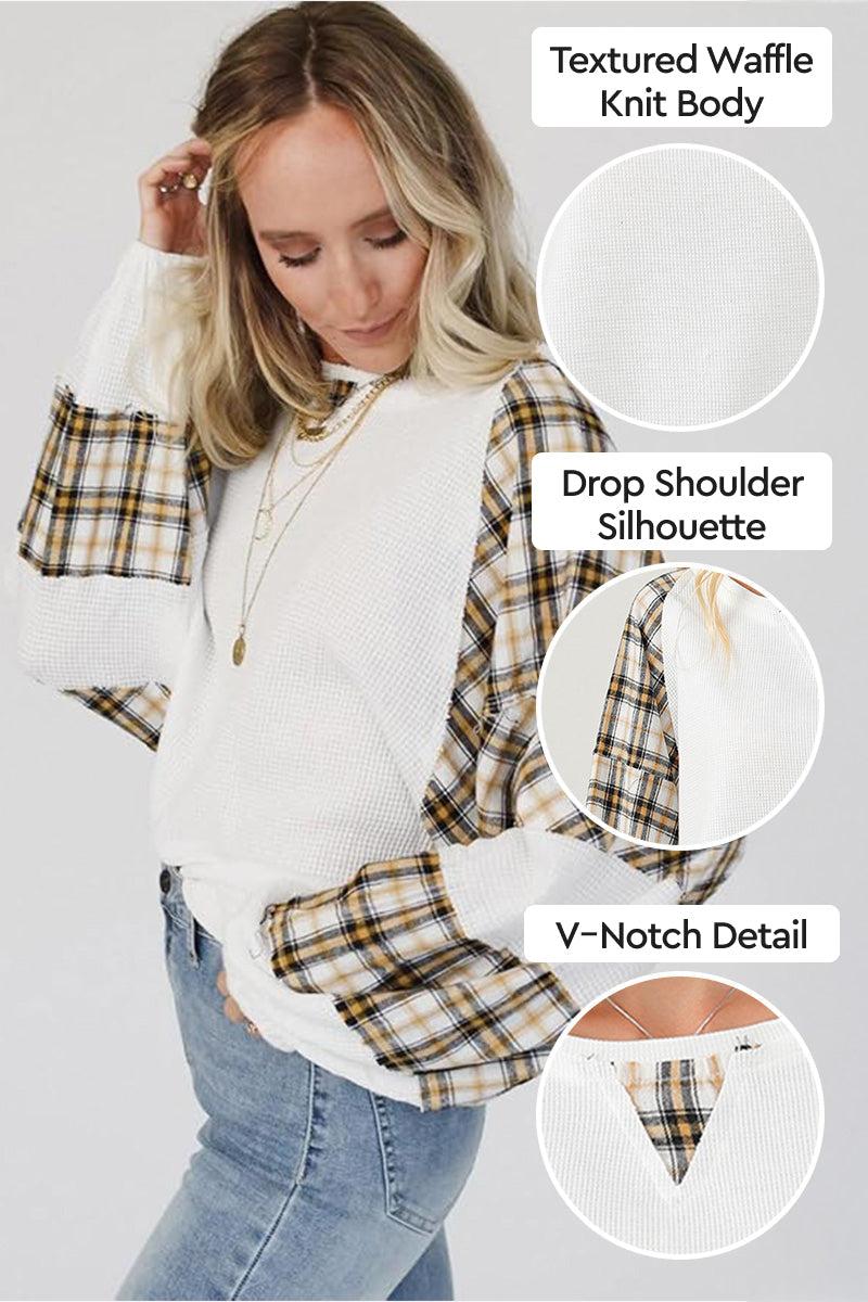 Waffle knit sweatshirt with plaid sleeves, drop shoulder fit, and V-notch detail
