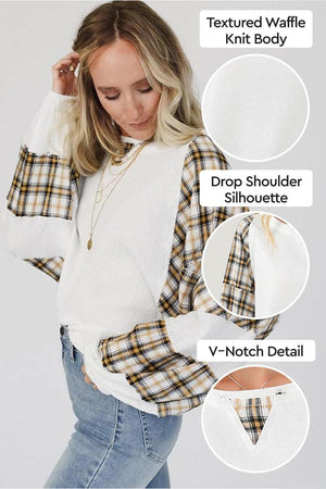 Waffle knit sweatshirt with plaid sleeves, drop shoulder fit, and V-notch detail