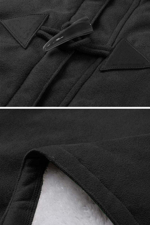Close-up of warm toggle button and soft faux suede fabric on a hooded coat with sherpa lining