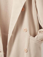 Modern double-breasted blazer with raw-edge seaming and soft cotton-blend fabric