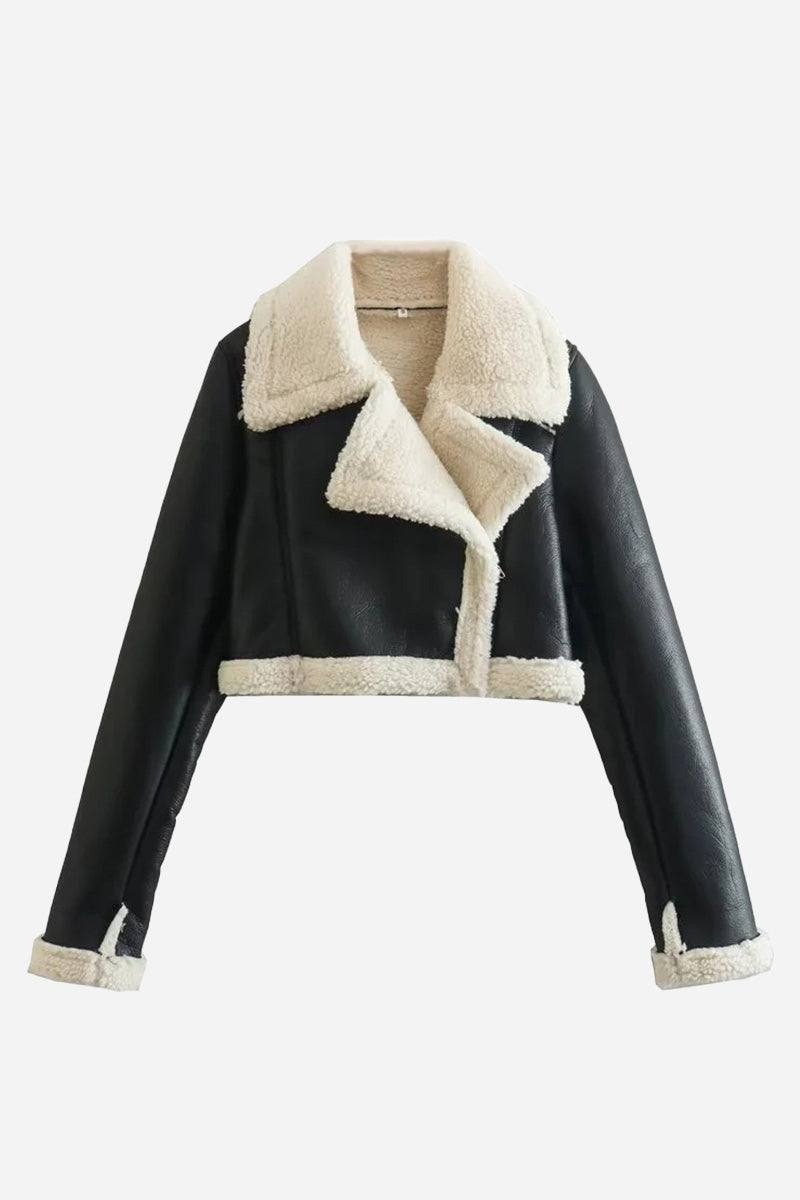Cropped faux leather jacket with soft cream sherpa lining and trim, full zip front, and wind-resistant design.