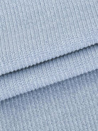 close-up of soft light blue waffle-knit fabric texture for waffle-knit two-piece clothing set