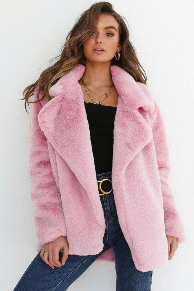 Pink open front oversized faux fur jacket with draped shawl collar on woman