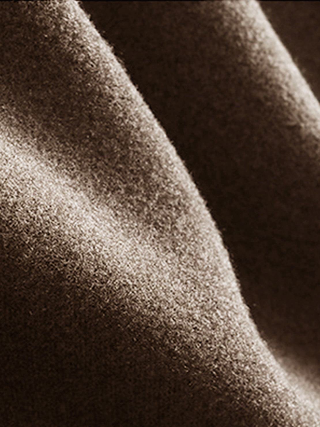 Close-up of soft brown lyocell-blend fleece fabric texture for hooded set clothing
